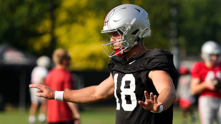 Aug 8, 2024; Columbus, Ohio, USA; Ohio State Buckeyes quarterback Will Howard (18) takes a snap during football practice at the Woody Hayes Athletic Complex.