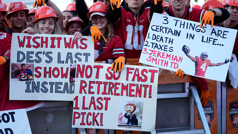 Fans hold signs in support of Lee Corso on the set of ESPN’s ‘College GameDay’ ahead of Ohio State-Texas.