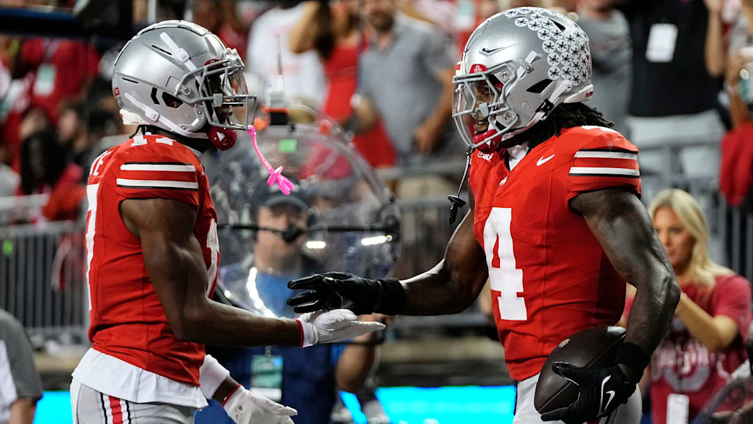 Ohio State Buckeyes wide receiver Carnell Tate (17) celebrates a touchdown by wide receiver Jeremiah Smith (4) during the first half of the NCAA football game against the Minnesota Golden Gophers at Ohio Stadium in Columbus on Oct. 4, 2025.