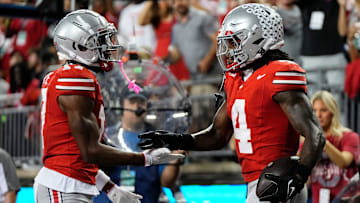 Ohio State Buckeyes wide receiver Carnell Tate (17) celebrates a touchdown by wide receiver Jeremiah Smith (4) during the first half of the NCAA football game against the Minnesota Golden Gophers at Ohio Stadium in Columbus on Oct. 4, 2025.