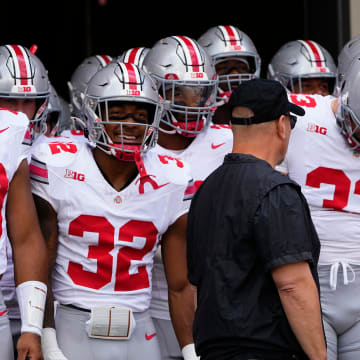 Sep 2, 2023; Bloomington, Indiana, USA; Ohio State Buckeyes tight end Gee Scott Jr. (88) and running back TreVeyon Henderson (32) prepare to take the field for the NCAA football game at Indiana University Memorial Stadium. Ohio State won 23-3.