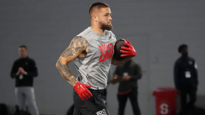 Mar 20, 2024; Columbus, Ohio, USA; Ohio State Buckeyes tight end Cade Stover runs after making a catch during Pro Day at the Woody Hayes Athletic Center.