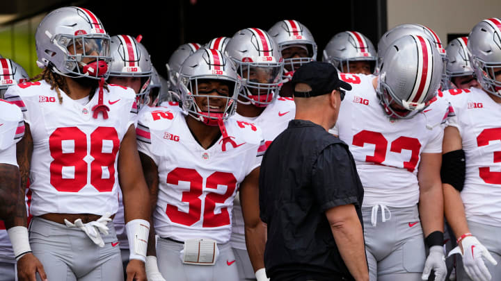 Sep 2, 2023; Bloomington, Indiana, USA; Ohio State Buckeyes tight end Gee Scott Jr. (88) and running back TreVeyon Henderson (32) prepare to take the field for the NCAA football game at Indiana University Memorial Stadium. Ohio State won 23-3.