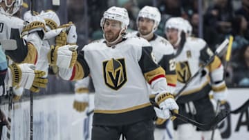 Mar 12, 2024; Seattle, Washington, USA; Vegas Golden Knights forward Jonathan Marchessault (81) is congratulated by teammates on then bench after scoring a power-play goal against the Seattle Kraken during the second period at Climate Pledge Arena. Mandatory Credit: Stephen Brashear-Imagn Images