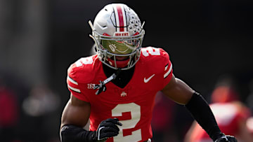 Ohio State Buckeyes defensive back Caleb Downs warms up during the NCAA football game against the Penn State Nittany Lions at Ohio Stadium
