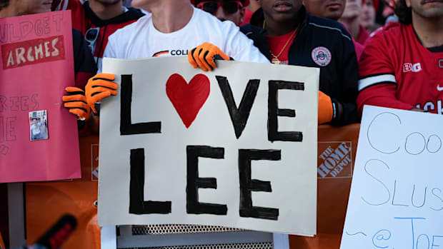 A fan holds a sign reading ‘Love Lee’ at ESPN’s ‘College GameDay.’