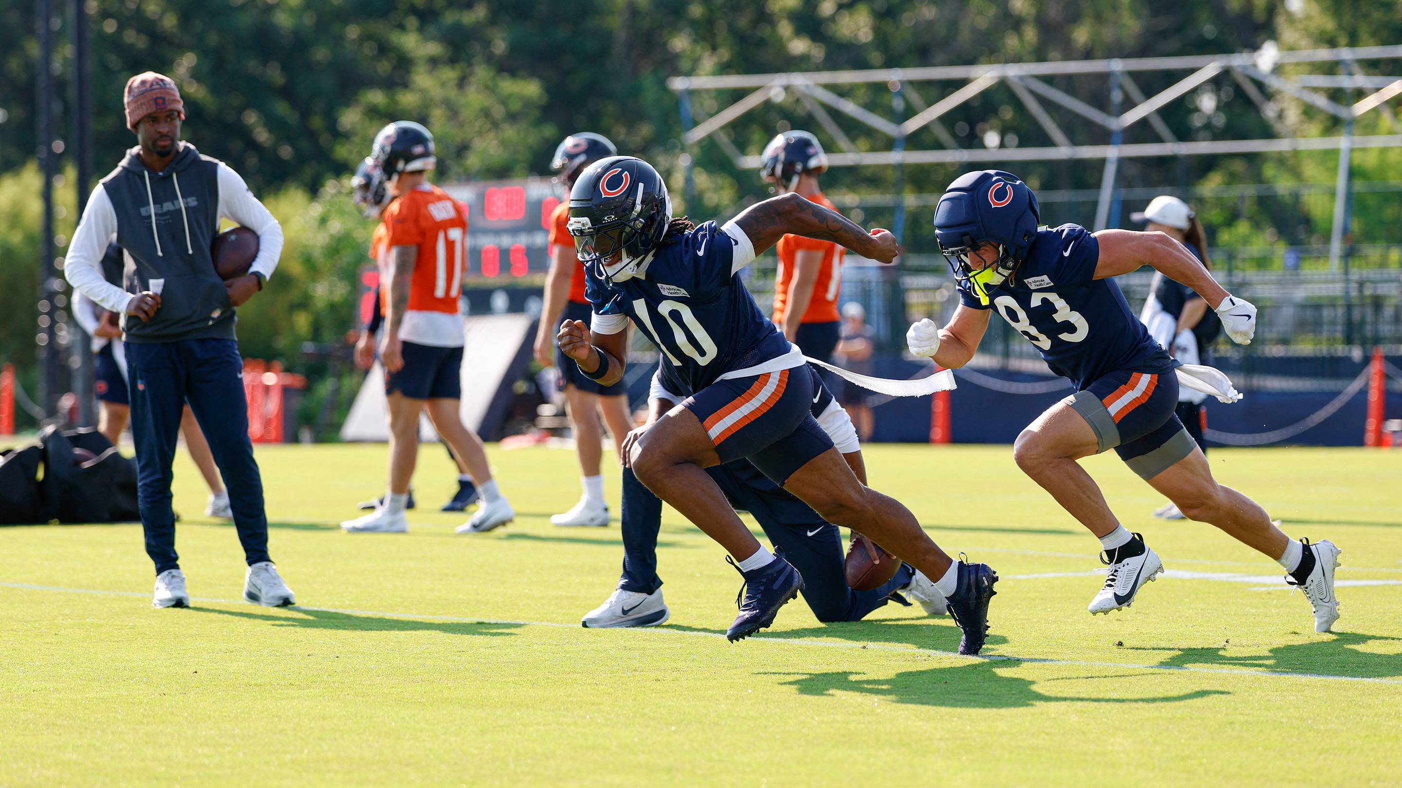 Luther Burden runs through drills in the early part of Bears practice.