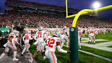 Sep 28, 2024; East Lansing, Michigan, USA; Ohio State Buckeyes take the field before the game against the Michigan State Spartans at Spartan Stadium on Saturday.