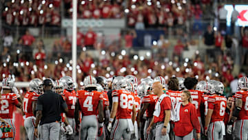 The Block O student section lights up the stadium with cell phone lights during a game against the Ohio Bobcats