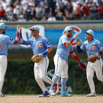 Jul 4, 2025; Chicago, Illinois, USA; Chicago Cubs players celebrate team's win against the St. Louis Cardinals at Wrigley Field.