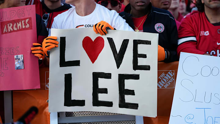 Fans hold signs in support of Lee Corso on the set of ESPN College GameDay prior to the NCAA football game between the Ohio State Buckeyes and the Texas Longhorns 