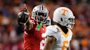 Ohio State Buckeyes wide receiver Emeka Egbuka celebrates a first-down catch behind Tennessee Volunteers defensive back Jalen McMurray.