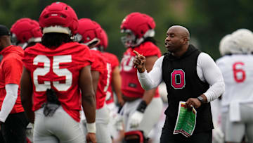 Ohio State Buckeyes running backs coach Carlos Locklyn motions to his team during the first football practice of the season at the Woody Hayes Athletic Center on July 31, 2025.