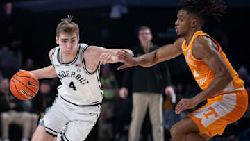 Vanderbilt Commodores guard Grant Huffman (4) drives against Tennessee Volunteers guard Chaz Lanier (2) during their game at Memorial Gym in Nashville, Tenn., Saturday, Jan. 18, 2025.