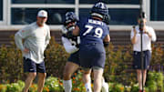 Jul 23, 2025; Lake Forest, IL, USA; Chicago Bears guard Theo Benedet (79) and offensive tackle Darnell Wright (58) run a drill during training camp at Halas Hall. Mandatory Credit: Kamil Krzaczynski-Imagn Images