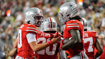 Ohio State Buckeyes quarterback Julian Sayin (10) celebrates a touchdown by wide receiver Jeremiah Smith (4) during the second half of the NCAA football game against the Ohio Bobcats at Ohio Stadium on Sept. 13, 2025. Ohio State won 37-9.