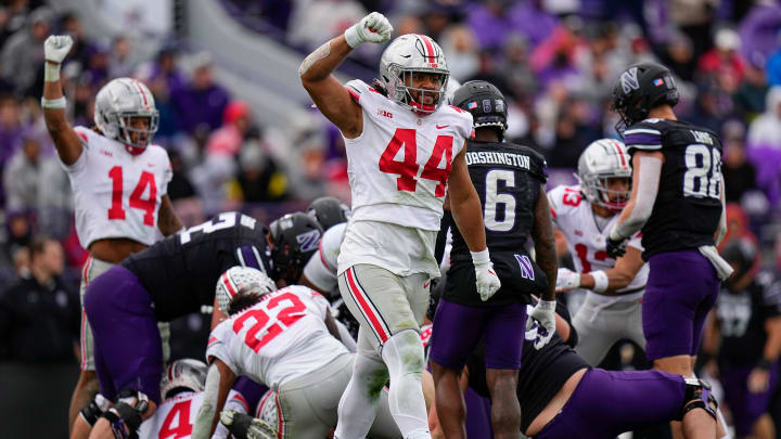 Nov 5, 2022; Evanston, Illinois, USA; Ohio State Buckeyes defensive end J.T. Tuimoloau (44) celebrates a stop during the second half of the NCAA football game against the Northwestern Wildcats at Ryan Field. Ohio State won 21-7. Mandatory Credit: Adam Cairns-The Columbus Dispatch

Ncaa Football Ohio State Buckeyes At Northwestern Wildcats