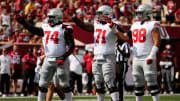 Sep 2, 2023; Bloomington, Indiana, USA; Ohio State Buckeyes offensive lineman Donovan Jackson (74), offensive lineman Josh Simmons (71) and offensive lineman Luke Montgomery (98) set up for a play during the NCAA football game at Indiana University Memorial Stadium. Ohio State won 23-3.