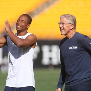 Sep 15, 2019; Pittsburgh, PA, USA;  Seattle Seahawks wide receiver Tyler Lockett (left) talk with head coach Pete Carroll (right) during warm-ups against the Pittsburgh Steelers at Heinz Field. The Seahawks won 28-26. Mandatory Credit: Charles LeClaire-USA TODAY Sports