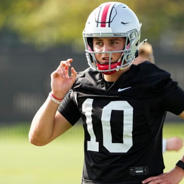 Aug 1, 2024; Columbus, OH, USA; Ohio State Buckeyes quarterback Julian Sayin (10) motions during football camp at the Woody Hayes Athletic Complex.