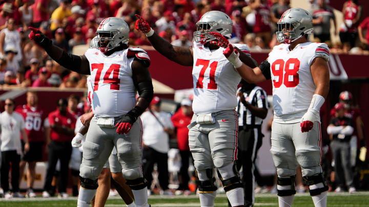 Sep 2, 2023; Bloomington, Indiana, USA; Ohio State Buckeyes offensive lineman Donovan Jackson (74), offensive lineman Josh Simmons (71) and offensive lineman Luke Montgomery (98) set up for a play during the NCAA football game at Indiana University Memorial Stadium. Ohio State won 23-3.