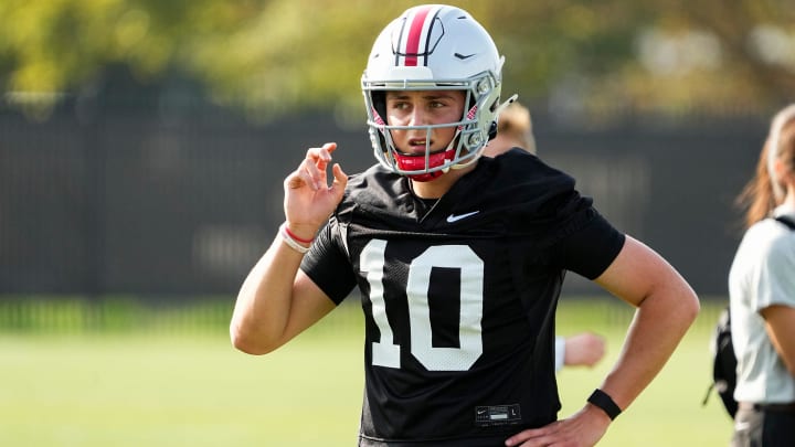 Aug 1, 2024; Columbus, OH, USA; Ohio State Buckeyes quarterback Julian Sayin (10) motions during football camp at the Woody Hayes Athletic Complex.