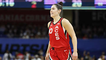 Aug 25, 2024; Chicago, Illinois, USA; Las Vegas Aces guard Kelsey Plum (10) smiles during the first half of a basketball game against the Chicago Sky at Wintrust Arena. Mandatory Credit: Kamil Krzaczynski-Imagn Images