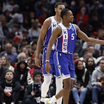 Feb 3, 2024; Chicago, Illinois, USA; Sacramento Kings guard De'Aaron Fox (5) celebrates with forward Domantas Sabonis (10) after scoring against the Chicago Bulls during the first half at United Center. Mandatory Credit: Kamil Krzaczynski-Imagn Images