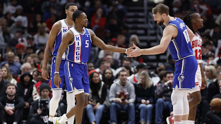 Feb 3, 2024; Chicago, Illinois, USA; Sacramento Kings guard De'Aaron Fox (5) celebrates with forward Domantas Sabonis (10) after scoring against the Chicago Bulls during the first half at United Center. Mandatory Credit: Kamil Krzaczynski-Imagn Images