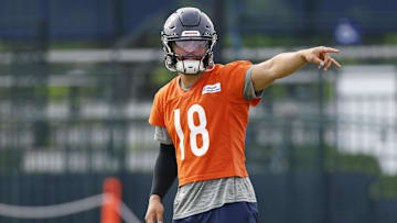 Jul 24, 2025; Lake Forest, IL, USA; Chicago Bears quarterback Caleb Williams (18) signals during training camp at Halas Hall. Mandatory Credit: Kamil Krzaczynski-Imagn Images