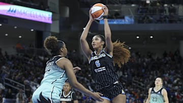 Chicago Sky forward Angel Reese drives to the basket against New York Liberty forward Kennedy Burke in a WNBA game