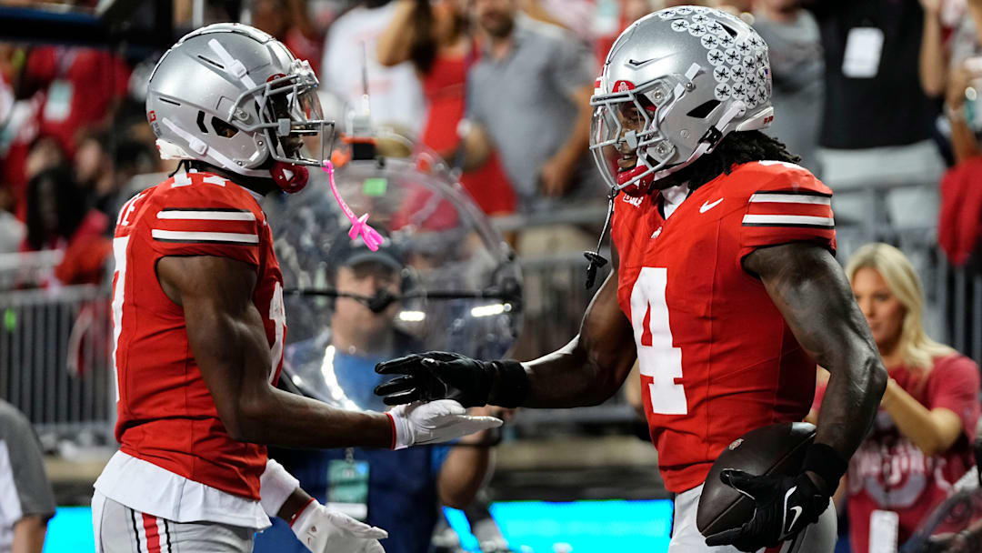 Ohio State Buckeyes wide receiver Carnell Tate (17) celebrates a touchdown by wide receiver Jeremiah Smith (4) during the first half of the NCAA football game against the Minnesota Golden Gophers at Ohio Stadium in Columbus on Oct. 4, 2025.