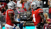 Ohio State Buckeyes wide receiver Carnell Tate (17) celebrates a touchdown by wide receiver Jeremiah Smith (4) during the first half of the NCAA football game against the Minnesota Golden Gophers at Ohio Stadium in Columbus on Oct. 4, 2025.