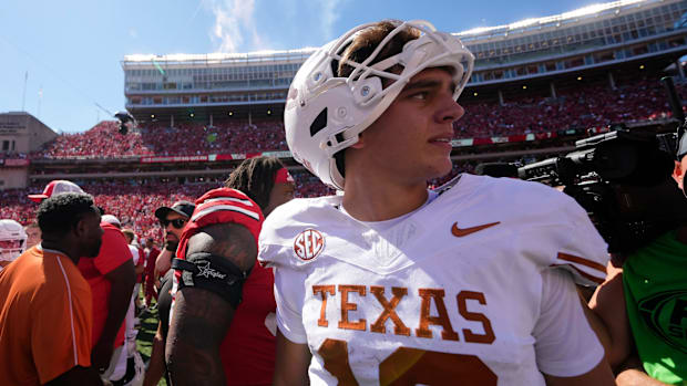 Texas Longhorns quarterback Arch Manning leaves the field