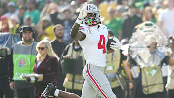 Ohio State Buckeyes wide receiver Jeremiah Smith (4) scores a touchdown during the first half of the College Football Playoff quarterfinal against the Oregon Ducks at the Rose Bowl in Pasadena, Calif. on Jan. 1, 2025.