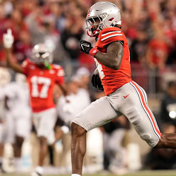 Sep 7, 2024; Columbus, Ohio, USA; Ohio State Buckeyes wide receiver Jeremiah Smith (4) runs for a touchdown after making a catch during the first half of the NCAA football game against the Western Michigan Broncos at Ohio Stadium.