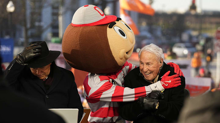 Ohio State mascot Brutus interacts with Lee Corso on the set of ESPN College GameDay prior to the College Football Playoff Ohio State mascot Brutus interacts with Lee Corso on the set of ESPN College GameDay prior to the College Football Playoff