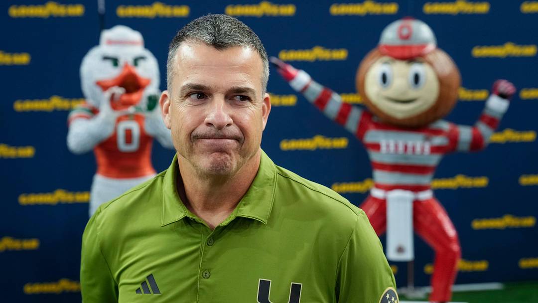 Miami Hurricanes head coach Mario Cristobal speaks during the Cotton Bowl Media Day at AT&T Stadium in Dallas prior to the College Football Playoff matchup against the Ohio State Buckeyes on Dec. 29, 2025. Miami Hurricanes head coach Mario Cristobal speaks during the Cotton Bowl Media Day at AT&T Stadium in Dallas prior to the College Football Playoff matchup against the Ohio State Buckeyes on Dec. 29, 2025.
