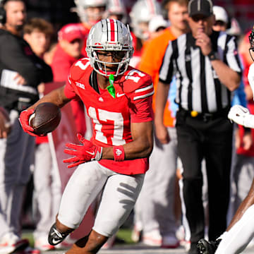 Ohio State Buckeyes wide receiver Carnell Tate (17) runs the ball