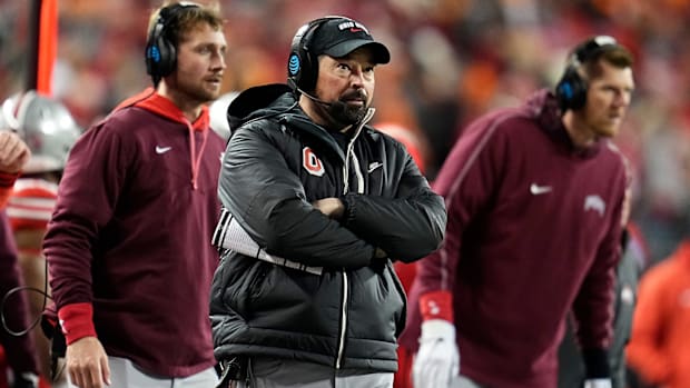 Ohio State Buckeyes head coach Ryan Day watches from the sideline during the first half of the College Football Playoff first