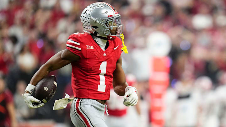 Ohio State Buckeyes cornerback Davison Igbinosun (1) celebrates an interception during the first half of the Big Ten Conference championship game against the Indiana Hoosiers at Lucas Oil Stadium in Indianapolis on Dec. 6, 2025.