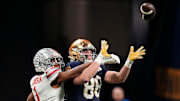 Ohio State Buckeyes cornerback Davison Igbinosun (1) attempts to break up a pass intended for Notre Dame Fighting Irish tight end Mitchell Evans (88) during the College Football Playoff championship at Mercedes-Benz Stadium in Atlanta on Jan. 20, 2025.