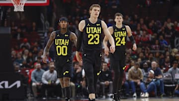Nov 6, 2023; Chicago, Illinois, USA; Utah Jazz forward Lauri Markkanen (23), Utah Jazz guard Jordan Clarkson (00) and Utah Jazz center Walker Kessler (24) walk on the court during the first half of a basketball game against the Chicago Bulls at United Center. Mandatory Credit: Kamil Krzaczynski-Imagn Images