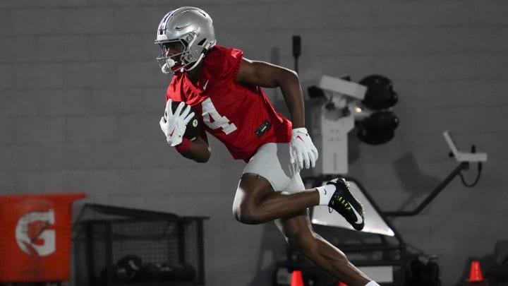 Mar 7, 2024; Columbus, OH, USA; Ohio State Buckeyes wide receiver Jeremiah Smith (4) catches a pass during spring football practice at the Woody Hayes Athletic Center.