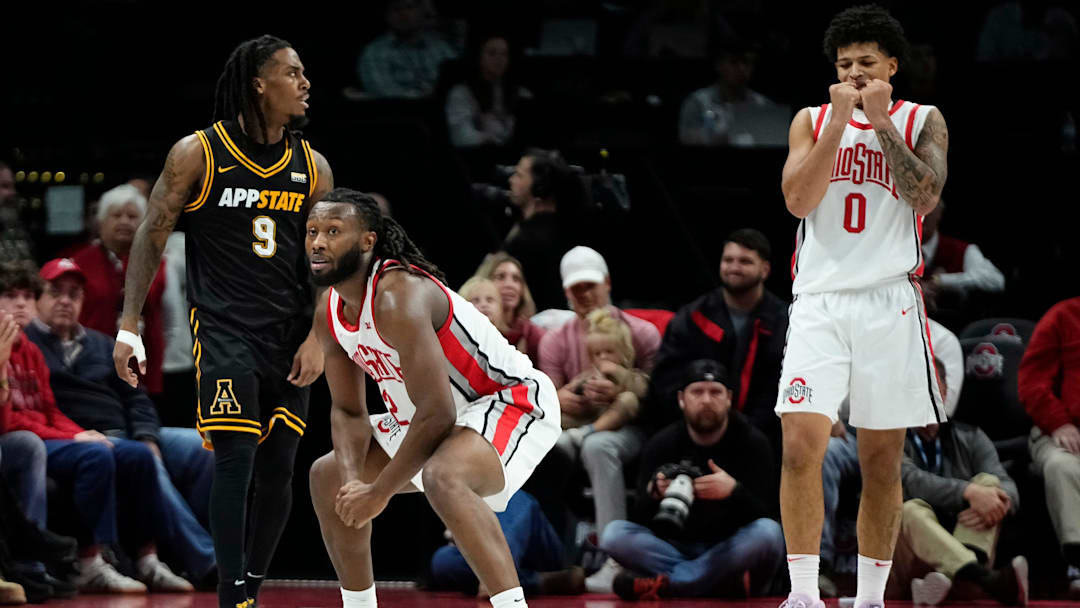 Ohio State Buckeyes guard Bruce Thornton (2) and guard John Mobley Jr. (0) react beside Appalachian State Mountaineers guard Jalen Tot (9) during the NCAA men's basketball game at Value City Arena in Columbus on Nov. 11, 2025. Ohio State won 75-53.