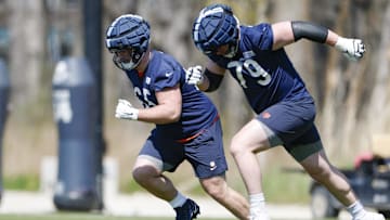 May 9, 2025; Lake Forest, IL, USA; Chicago Bears offensive line Luke Newman (65) and Theo Benedet (79) run during the Rookie Minicamp at Halas Hall