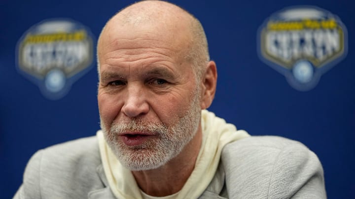 Ohio State Buckeyes defensive coordinator Jim Knowles talks to media shortly after the team arrived in Dallas for the College Football Playoff semifinal at the Cotton Bowl/