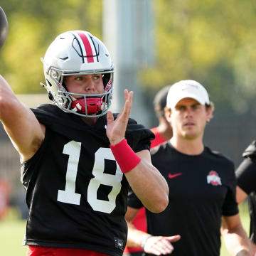 Aug 1, 2024; Columbus, OH, USA; Ohio State Buckeyes quarterback Will Howard (18) throws during football camp at the Woody Hayes Athletic Complex.