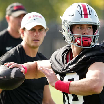 Aug 1, 2024; Columbus, OH, USA; Ohio State Buckeyes quarterback Will Howard (18) throws during football camp at the Woody Hayes Athletic Complex.