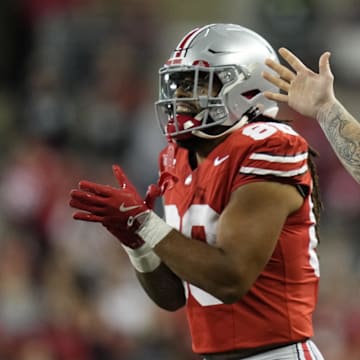 Sep 7, 2024; Columbus, Ohio, USA;  Ohio State Buckeyes tight end Gee Scott Jr. (88) and defensive end Jack Sawyer (33) celebrate after a touchdown by tight end Bennett Christian (not pictured)  against the Western Michigan Broncos during the second half at Ohio Stadium.